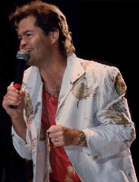 MICKY DOLENZ SINGING DURING A CONCERT