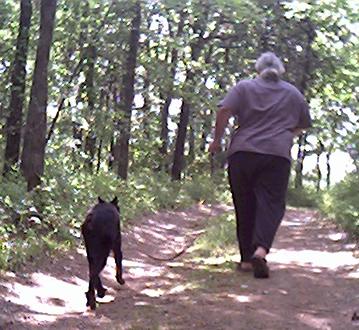Mike and Mantra jog up the shady drive