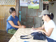 A student taking an interview in the community.