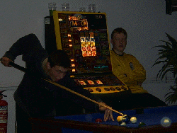 Jeff trying to play pool with a knome sat on his stool!