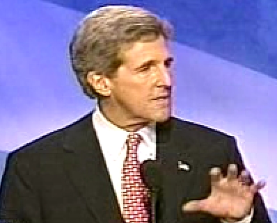 Kerry holding out his left hand waist high palm down