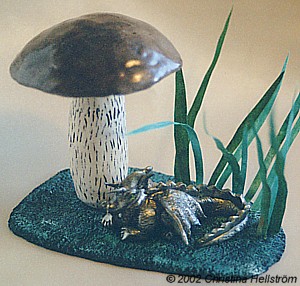 Small dragon under a mushroom