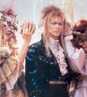 Woman fawning over Jareth at the ball with mirrors.