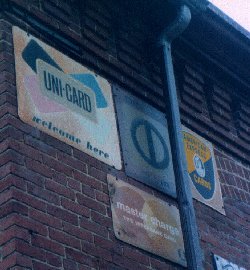 Old credit card signs on Precision Engine Rebuilding, Somerville