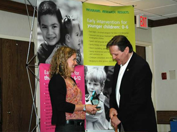 Karen presents Ted with award