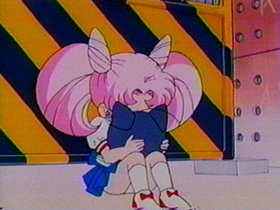 Holding the Luna P, Chibi Usa's underwear shows betewwn her legs