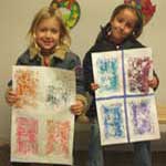 Zoe and Ali showing off their artwork.
