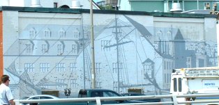 painting on wall in back of building