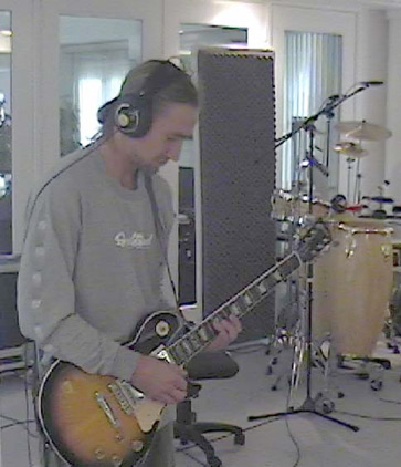 Tokin' J strums the 6 string at Big Idea Studios....