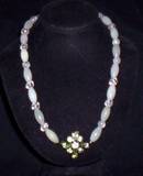 serpintine with iced quartz and modern green rhinestone pin