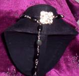 back of choker with rhinestone at nape of neck