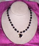 vintage black glass pendant with black and clear vintage plastic beads