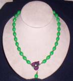 vintage green plastic beads with plastic pansy