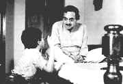 Monmohan Mitra (Utpal Dutta) and Anila's  (Mamata Shankar) son  in " Agantuk "