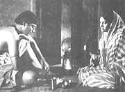 Gangacharan Chakraborty (Soumitra Chatterjee) and Ananga (Babita)  in " Asani Sanket "