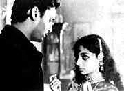 Umaprasad (Soumitra Chatterjee) and Doyamoyee (Sharmila Tagore) in " Debi "