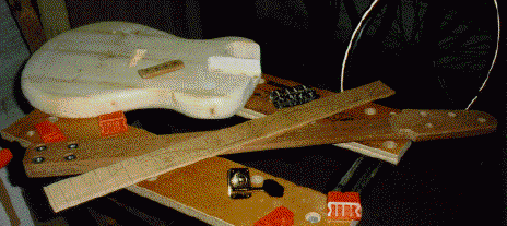 neck, body and fretboard ready for assembly