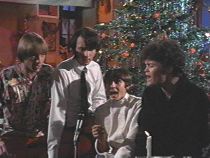 The guys signing Riu Chiu in the "Monkees Christmas Show"