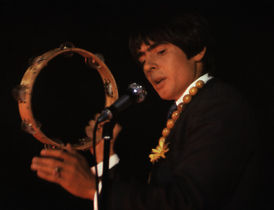 Davy playing a tambourine in concert