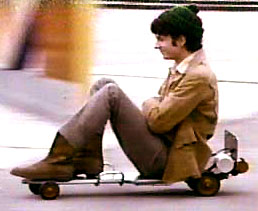 Mike on a motorized skateboard in the beginning credits of the second season