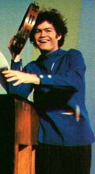 Micky singing and playing the tambourine for Daydream Believer