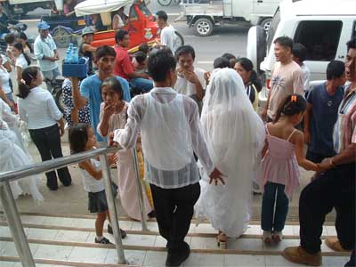Married couple walking down stairs of church
