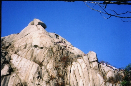 People waiting to get to the summit