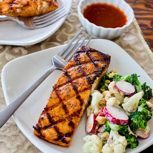An herb grilled salmon with vegetables.