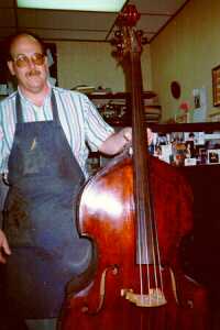 Barrie Kolstein holding the LaFaro-Prescott bass (front)