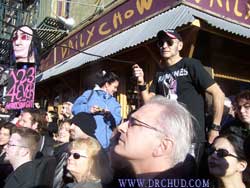 Arturo attends to his post and waits for the right time to pull the string that's attached to the t-shirt! 