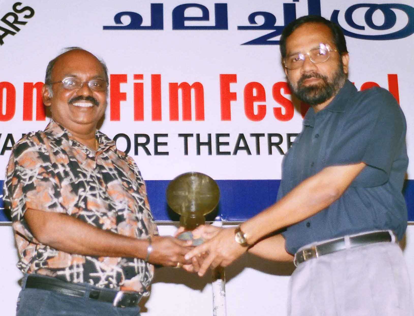 Ramachandra Babu receiving the Festival Memento