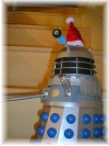 A Dalek on the Stairs, wearing a festive hat!