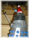 A Dalek on the Stairs, wearing a festive hat!