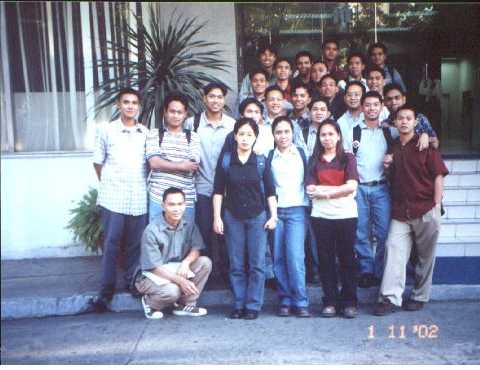 the group at the facade of PLC.