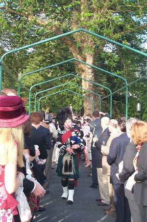 Led by a bagpipe player...