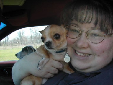 Me, Sprite & Clover getting to go for a ride, but first I buckle them into their seat belts.. yep seat belt for dogs too.. they need to be kept safe as well.