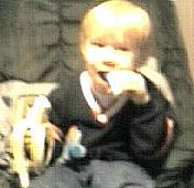 taking bite of banana