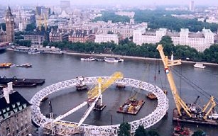The London Eye under constuction over the River Thames.