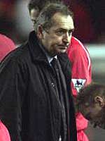 Liverpool boss Gerrard Houllier heads for the dressing room following the shock defeat of his team.