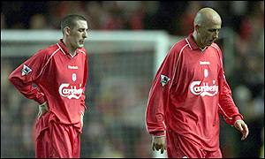 Stephen Wright and Pool goalscorer Gary McAllister head off the field also in shock.