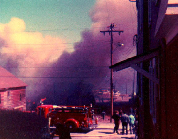 Old Suzie at her last big call, 1979 boat shed fire at Finke's Marina.