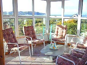 The conservatory - access through the French doors from the lounge - magnificent sea views