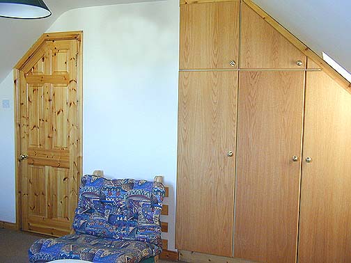 Plenty of wardrobe space and footon for a third person