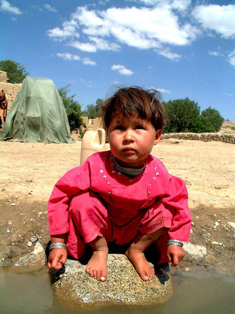 Squatting child in Bamiyan, Afghanistan