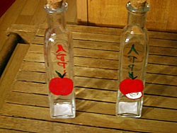 Handpainted jars.&nbsp; As you can see, one side has an apple and the other side says "Apple".&nbsp; They come with your choice of a cork top or a pour spout.&nbsp; Great for anything.&nbsp; (I have red dish soap in mine)&nbsp; I can also do other designs.