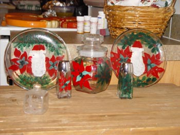 Poinsetta/Santa Claus dinner plates 8" with matching jar and s/p shakers