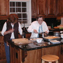 barbara and opal getting the gravy and other delacacies together (aka: waiting for the turkey)