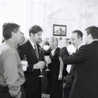 ryan, steve, eric (eating), and sam all talking geeky talk together.&nbsp; ryan's mom looks dubious in the background...
