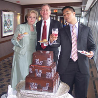 left to their own devices, kaki, jim, and art pose at the cake