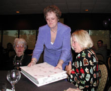 kaki presents the book to aunt betsy